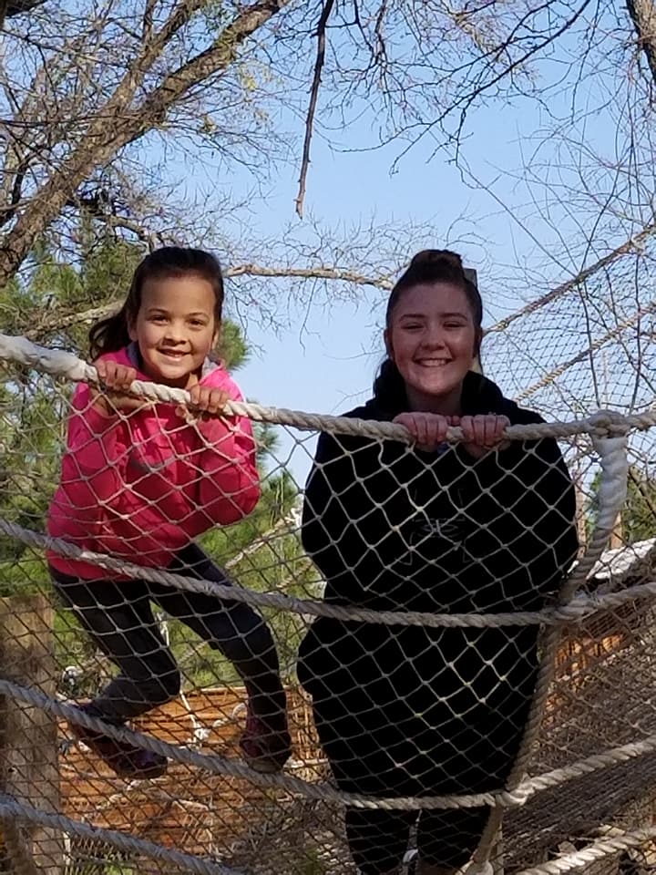 girls climbing on obstacle climb