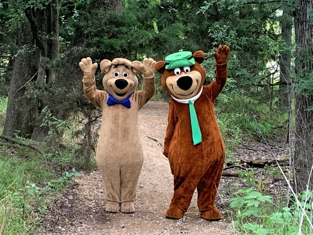 Yogi Bear and Boo Boo waving on the Nature Trail